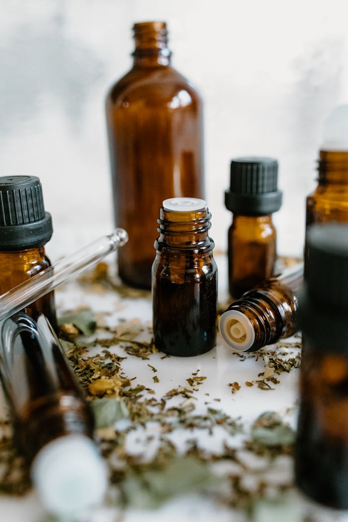Services A close-up of amber bottles with essential oils, showcasing natural healing properties.